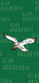 Eagle flying on green 'Go Birds' wallpaper.