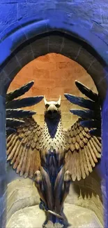 Mystical eagle statue in a stone archway with blue hues.