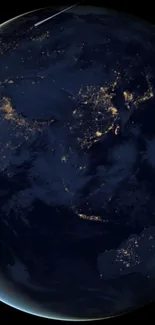 Satellite view of Earth's city lights from space in a dark blue wallpaper.