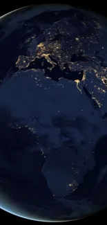 Earth at night with illuminated continents as seen from space.