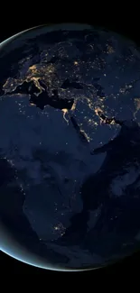 Earth illuminated by city lights at night from space.