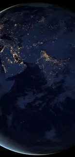 Earth's night view with glowing lights and dark blue tones.