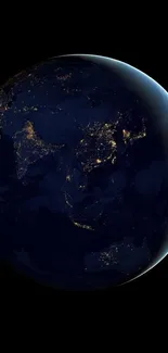 Earth illuminated against a dark night sky viewed from space.