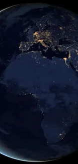 A stunning view of Earth at night, showing city lights across continents.