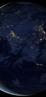 Dark blue Earth at night with glowing city lights visible.