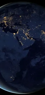 Earth at night with illuminated cities on a dark blue backdrop.