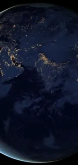 Earth at night with glowing city lights and dark blue oceans wallpaper.