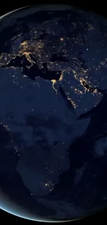 Earth at night with city lights visible from space.