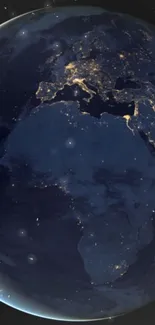 Earth viewed from space with glowing city lights at night.