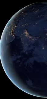 Image of Earth from space at night with glowing city lights.