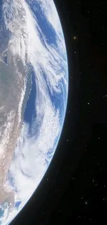 Beautiful view of Earth from space, surrounded by a star-filled sky.