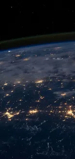 A breathtaking view of Earth from space showing city lights and oceans.