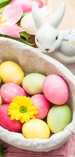 Colorful Easter eggs in a basket with a ceramic bunny and flowers.