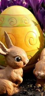 Adorable bunnies with a decorative Easter egg and purple flowers.