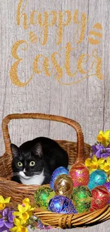 Easter cat in wicker basket with colorful eggs and flowers on wooden background.