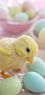 Fluffy Easter chick with pastel colored eggs in background.