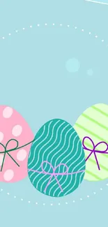 Pastel-colored Easter eggs on a light blue background with decorative patterns.