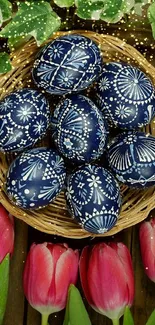 Wicker basket with blue Easter eggs and pink tulips.