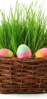 Colorful Easter eggs in a green grass-filled basket.