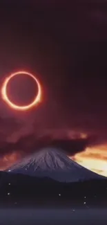 Solar eclipse over a mountain with a purple sky.