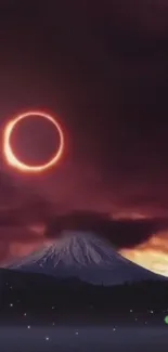 Eclipse over a snowy mountain under a dark red sky.