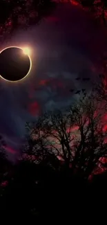 Eclipse in a dark forest with a red and blue swirling sky.