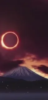 Solar eclipse over mountain with purple sky.