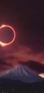 Solar eclipse above mountain with purple sky.