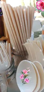 Beige sustainable utensils with floral accents.