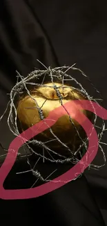 Golden apple wrapped in barbed wire on a dark background.