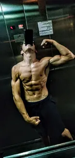 Muscular individual takes a gym selfie in an elevator, showcasing strength and fitness.