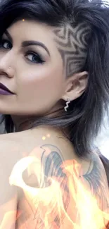 Woman with edgy hairstyle and wing tattoo on shoulder.