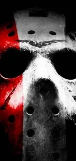 Red and black horror mask wallpaper with striking contrast.