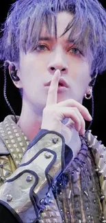 Edgy performer with lavender hair in stylish outfit, finger on lips.