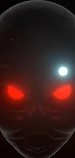 Alien face with glowing red eyes on dark background wallpaper.