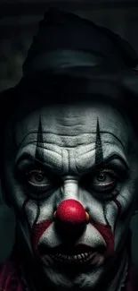 Dark eerie clown portrait with intense expression and shadows.