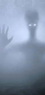 Eerie wallpaper featuring a foggy silhouette with glowing eyes.