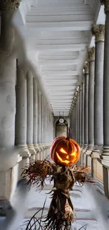 Glowing pumpkin in a gothic archway with columns.