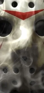 Eerie hockey mask with swirling smoke art.