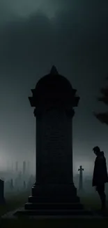 Silhouetted figure at night in a misty graveyard.