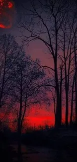 Eerie crimson skyline with silhouetted trees and a red moon.