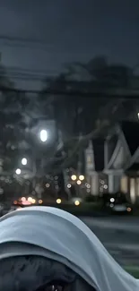 Eerie street at night with shadows.