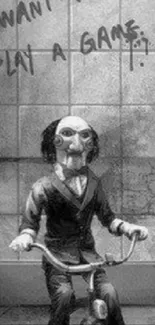 Eerie puppet on tricycle, black and gray wallpaper.