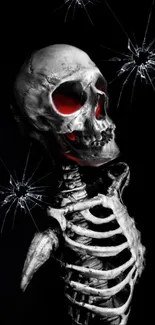 A dark skeleton with red eyes and shattered glass on black background.