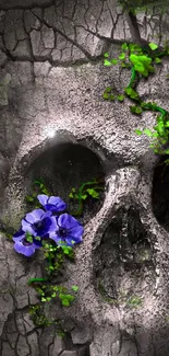 Creepy skull with green vines and purple flowers on cracked stone.