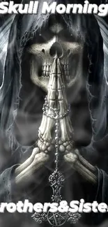 Hooded skeleton praying in darkness, creating an eerie and mystical wallpaper design.