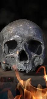 Dark skull with surrounding fiery flames.