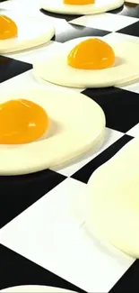 Sunny side up eggs on a black and white checkered pattern.