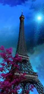 Eiffel Tower with pink tree under a starry blue sky.