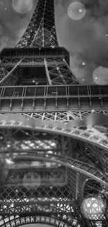 Monochrome Eiffel Tower view with bokeh in the sky.